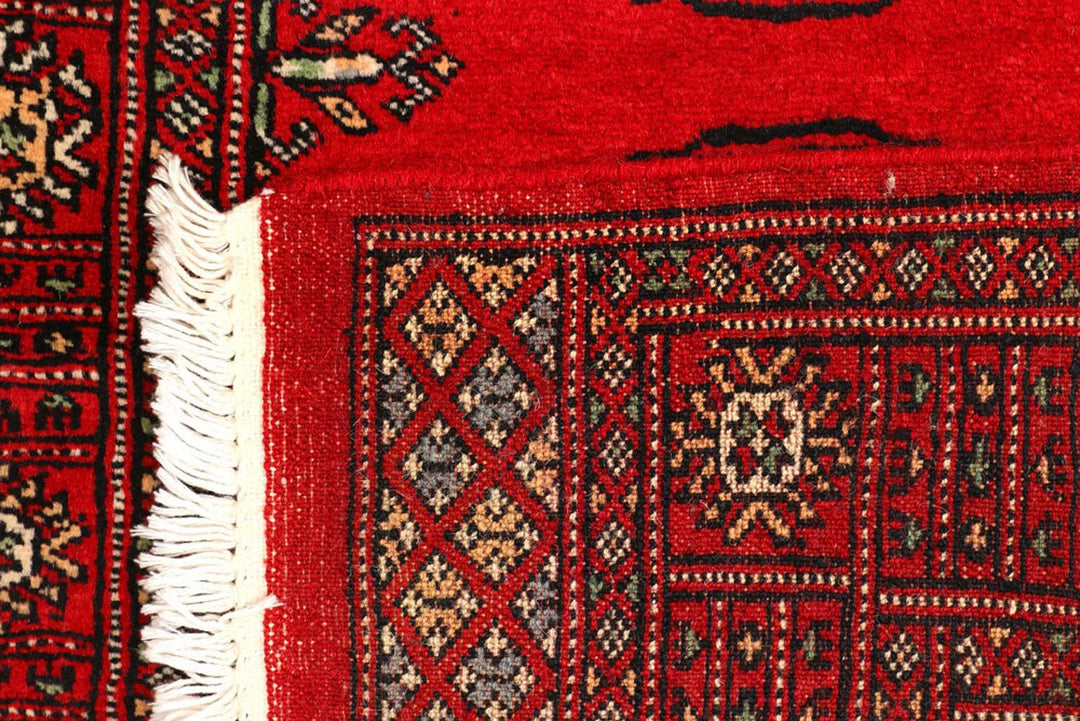 Red Pakistani Bokhara Rug 2' 7" x 9' 5" Hand-Knotted | No. QA93872