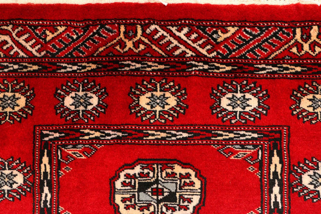 Red Pakistani Bokhara Rug 2' 7" x 9' 9" Hand-Knotted | No. QA95162