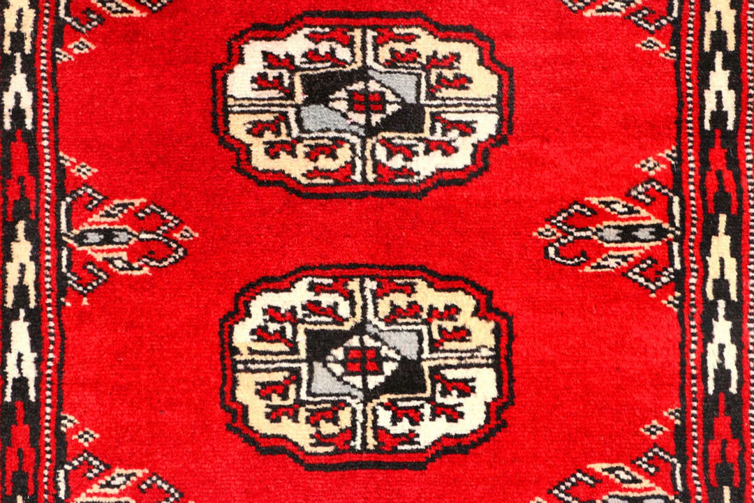 Red Pakistani Bokhara Rug 2' 7" x 9' 9" Hand-Knotted | No. QA95162