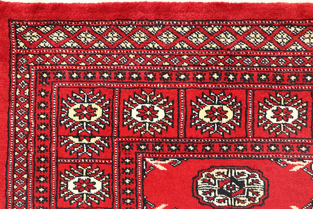 Red Pakistani Bokhara Rug 6' 2" x 9' 1" Hand-Knotted | No. QA95325