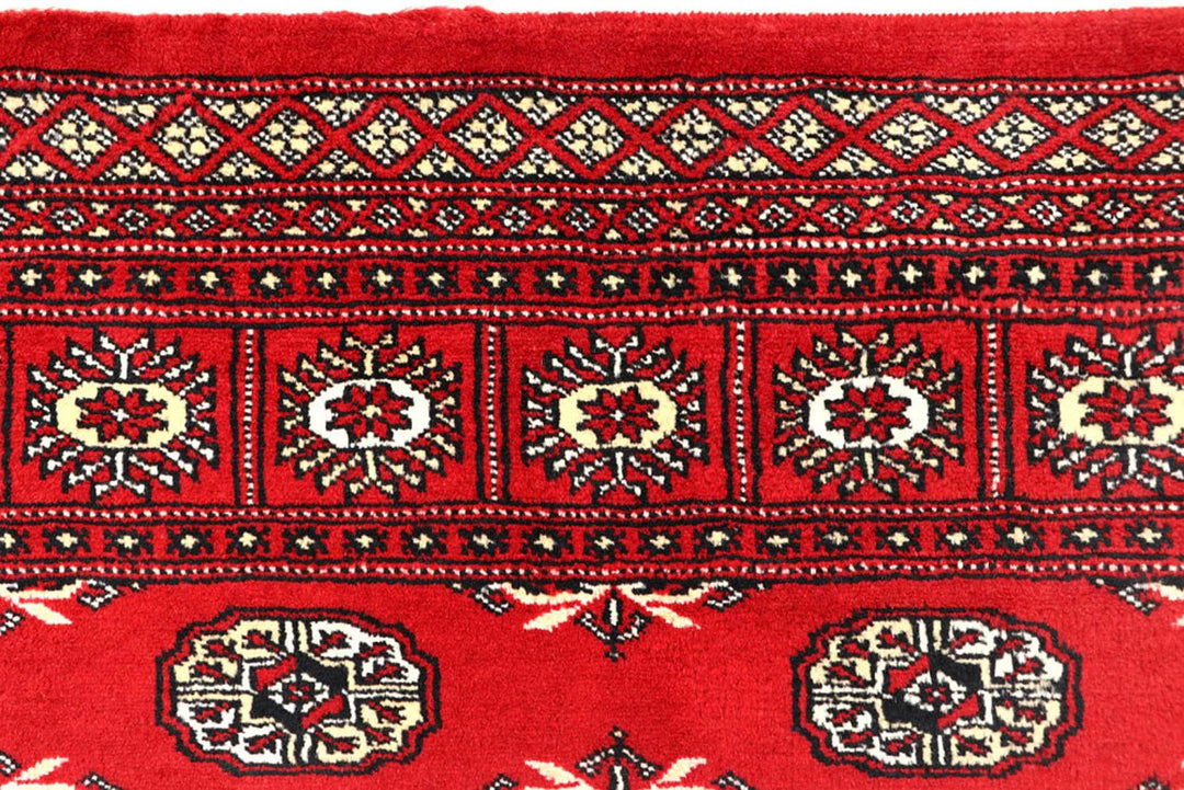 Red Pakistani Bokhara Rug 6' 2" x 9' 1" Hand-Knotted | No. QA95325