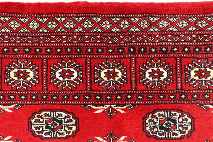 Red Pakistani Bokhara Rug 6' 2" x 9' 1" Hand-Knotted | No. QA95325