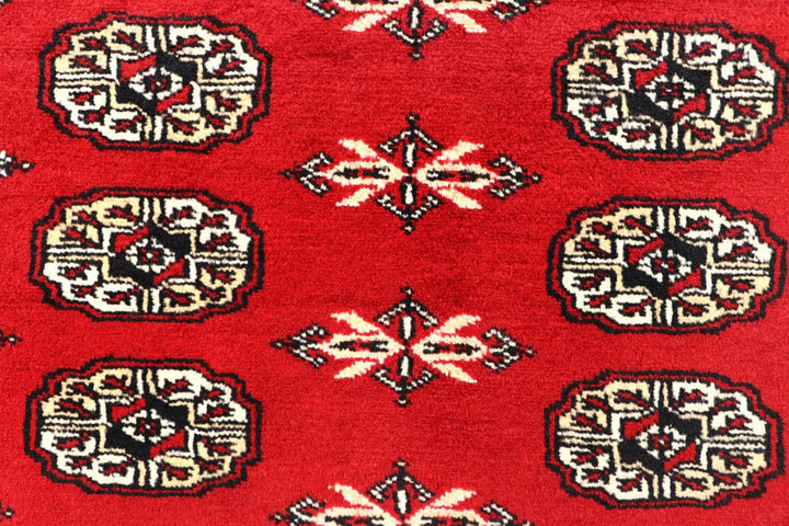 Red Pakistani Bokhara Rug 6' 2" x 9' 1" Hand-Knotted | No. QA95325