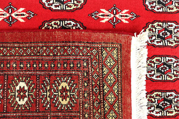 Red Pakistani Bokhara Rug 6' 2" x 9' 1" Hand-Knotted | No. QA95325