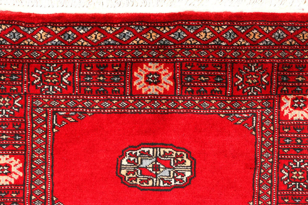 Red Pakistani Bokhara Rug 2' 7" x 9' 1" Hand-Knotted | No. QA95500