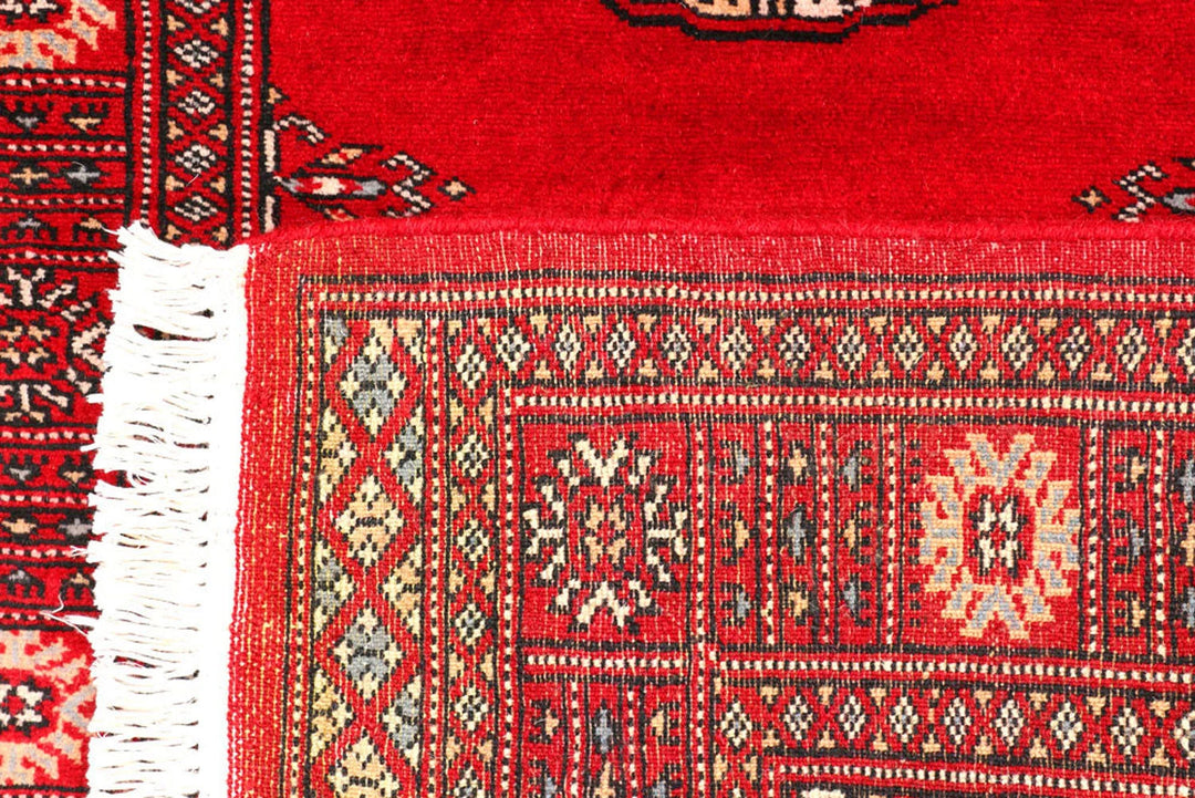 Red Pakistani Bokhara Rug 2' 7" x 9' 1" Hand-Knotted | No. QA95500