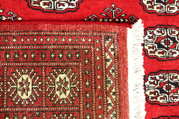 Red Bokhara Rug 4' 11" x 8' 2" Hand-Knotted | No. QA97624