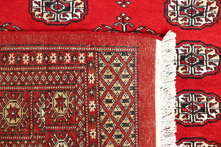 Red Pakistani Bokhara Rug 5' 6" x 8' Hand-Knotted | No. QA98186