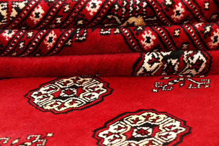 Firebrick Pakistani Bokhara Rug 6' 2" x 9' 1" Hand-Knotted | No. QA98989