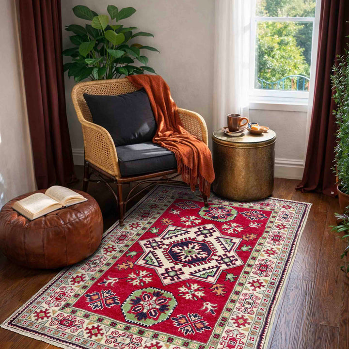 Red Afghan Kazak Rug 3' 3" x 5' 0" Hand-Knotted texture