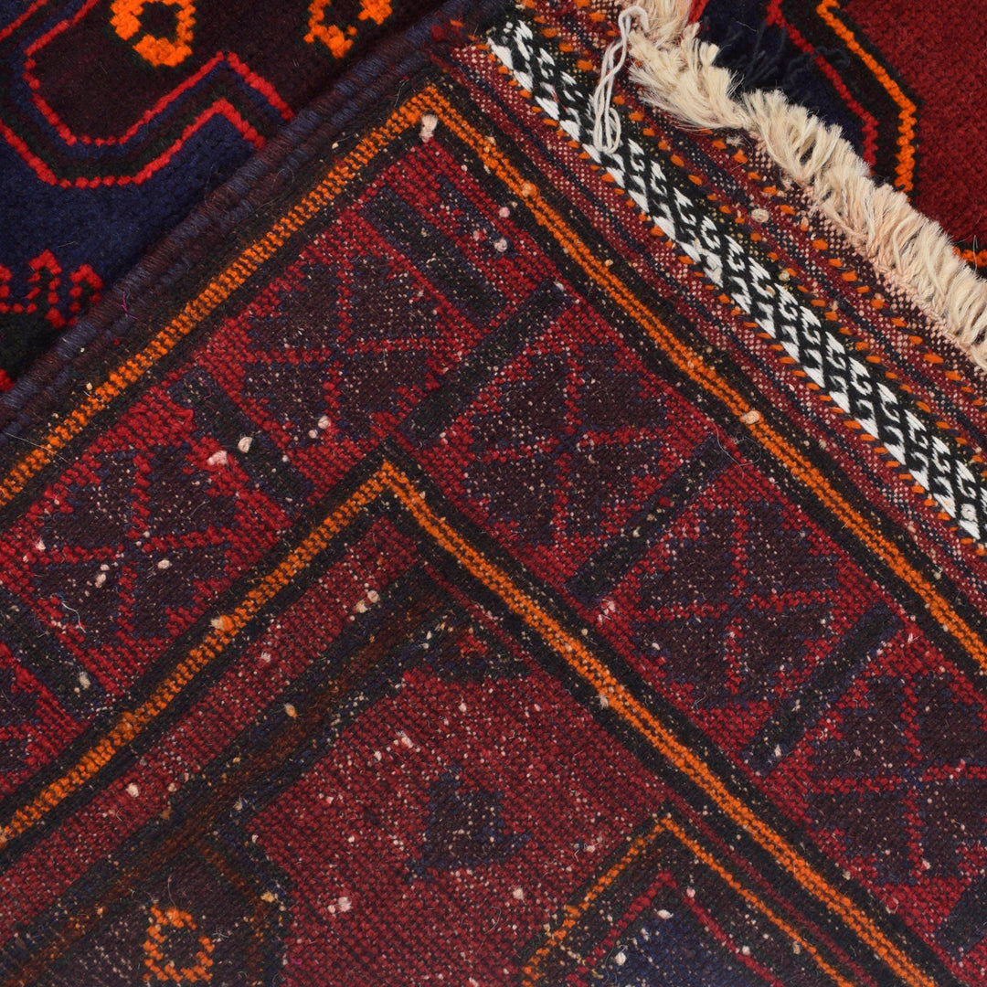Red Afghan Baluchi Rug 4' 1" x 6' 5" Hand-Knotted border