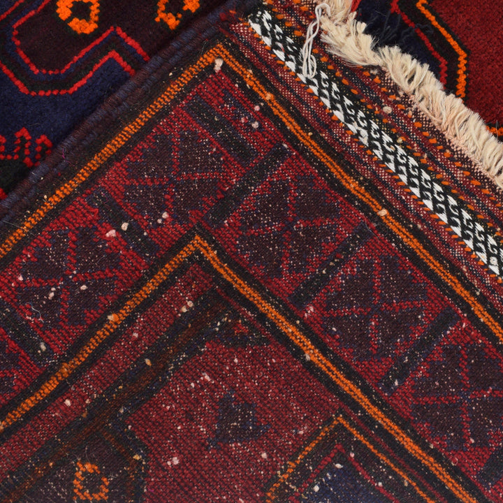 Red Afghan Baluchi Rug 4' 1" x 6' 5" Hand-Knotted border