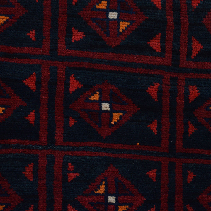 Afghan Baluchi Rug 4' 2" x 5' 11" Hand-Knotted close-up