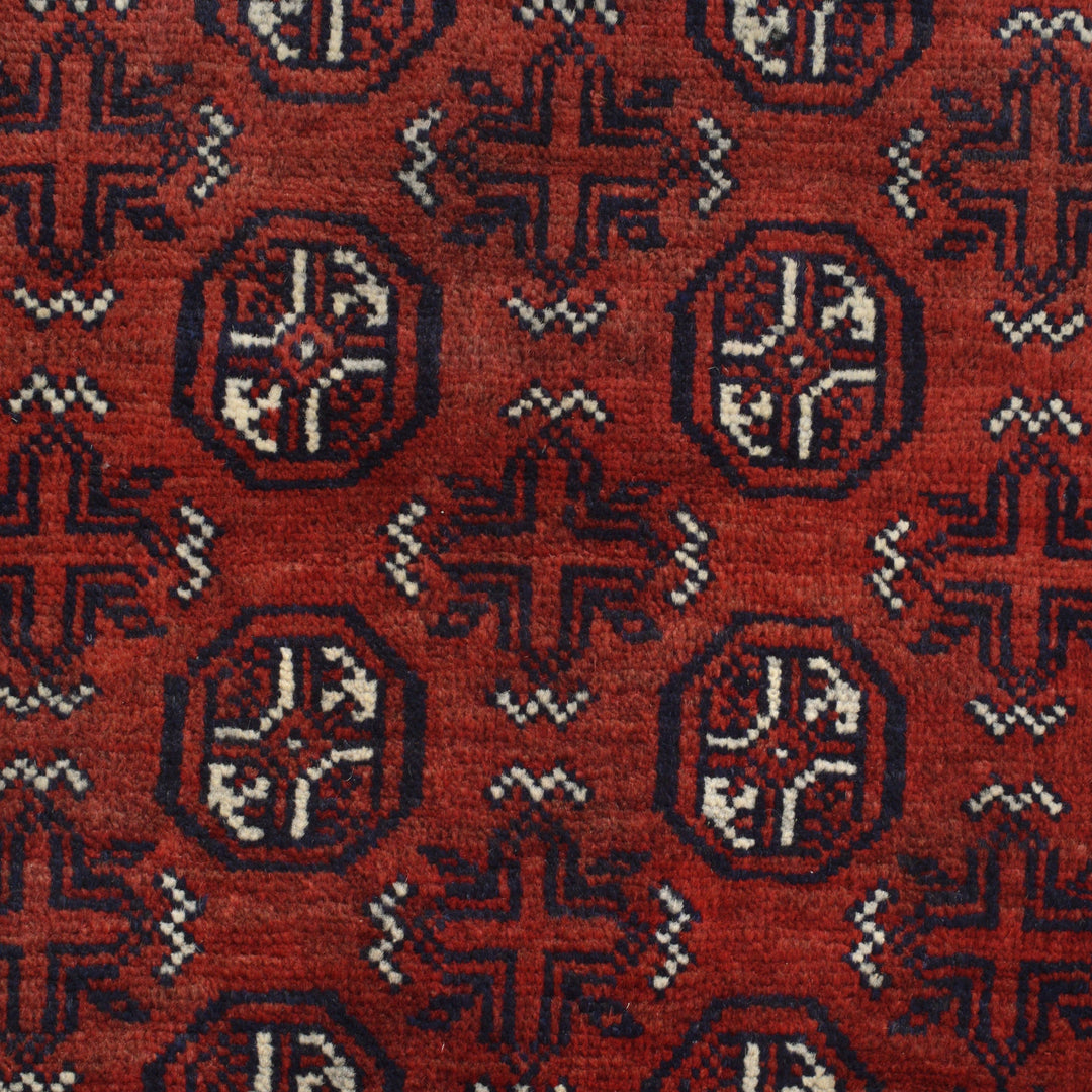 Red Afghan Baluchi Rug 3' 4" x 5' 11" Hand-Knotted close-up