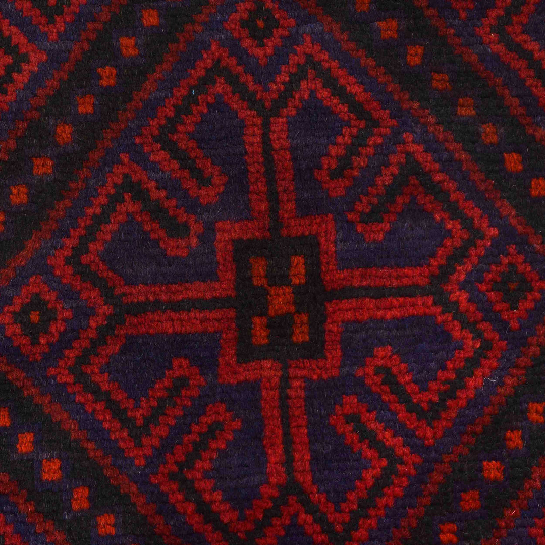 Afghan Baluchi Rug 4' 0" x 6' 4" Hand-Knotted close-up