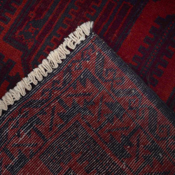 Red Afghan Baluchi Rug 2' 9" x 4' 3" Hand-Knotted close-up