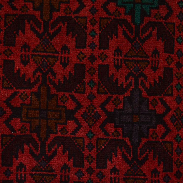 Red Afghan Baluchi Rug 4' 2" x 6' 1" Hand-Knotted close-up
