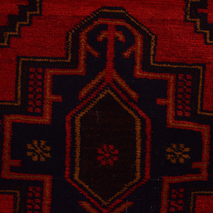 Red Afghan Baluchi Rug 4' 1" x 6' 1" Hand-Knotted close-up