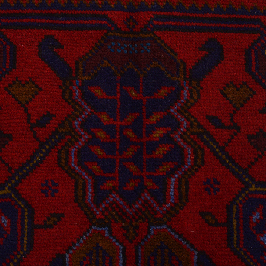 Red Afghan Baluchi Rug 3' 10" x 5' 9" Hand-Knotted close-up