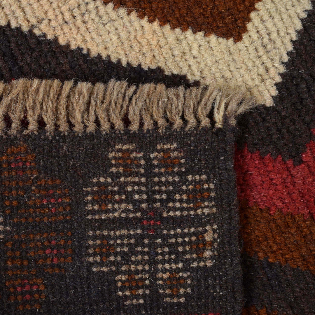 Afghan Baluchi Rug 2' 9" x 4' 7" Hand-Knotted close-up