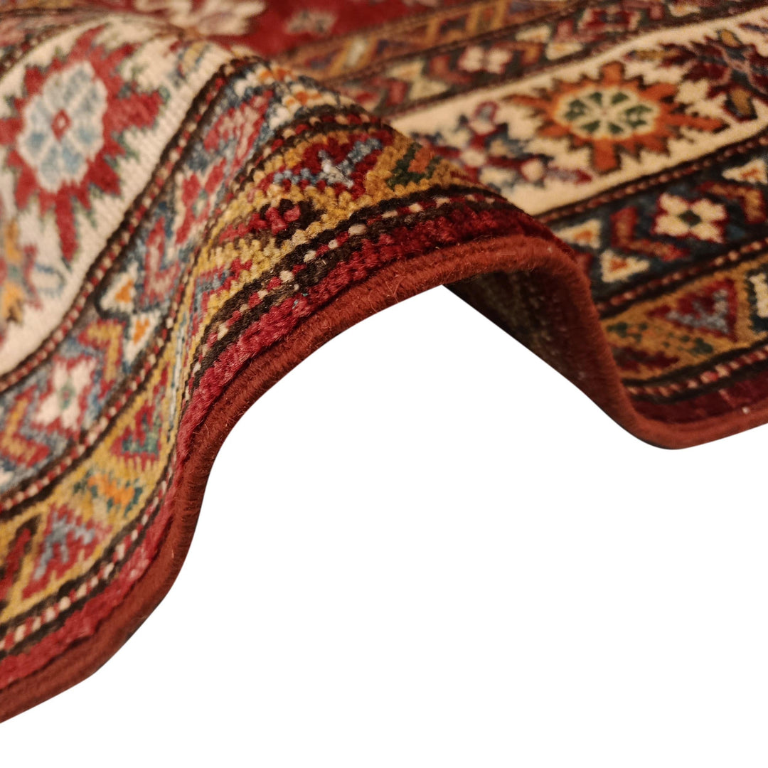 Red Afghan Kazak Rug 4' 1" x 5' 7" Hand-Knotted texture