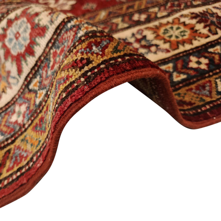 Red Afghan Kazak Rug 4' 1" x 5' 7" Hand-Knotted texture