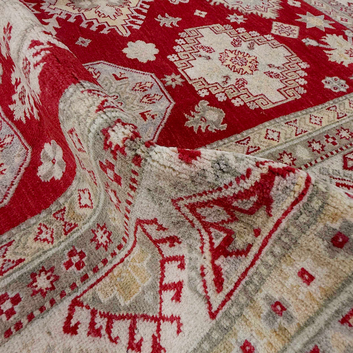 Red Afghan Kazak Rug 6' 8" x 9' 8" Hand-Knotted texture