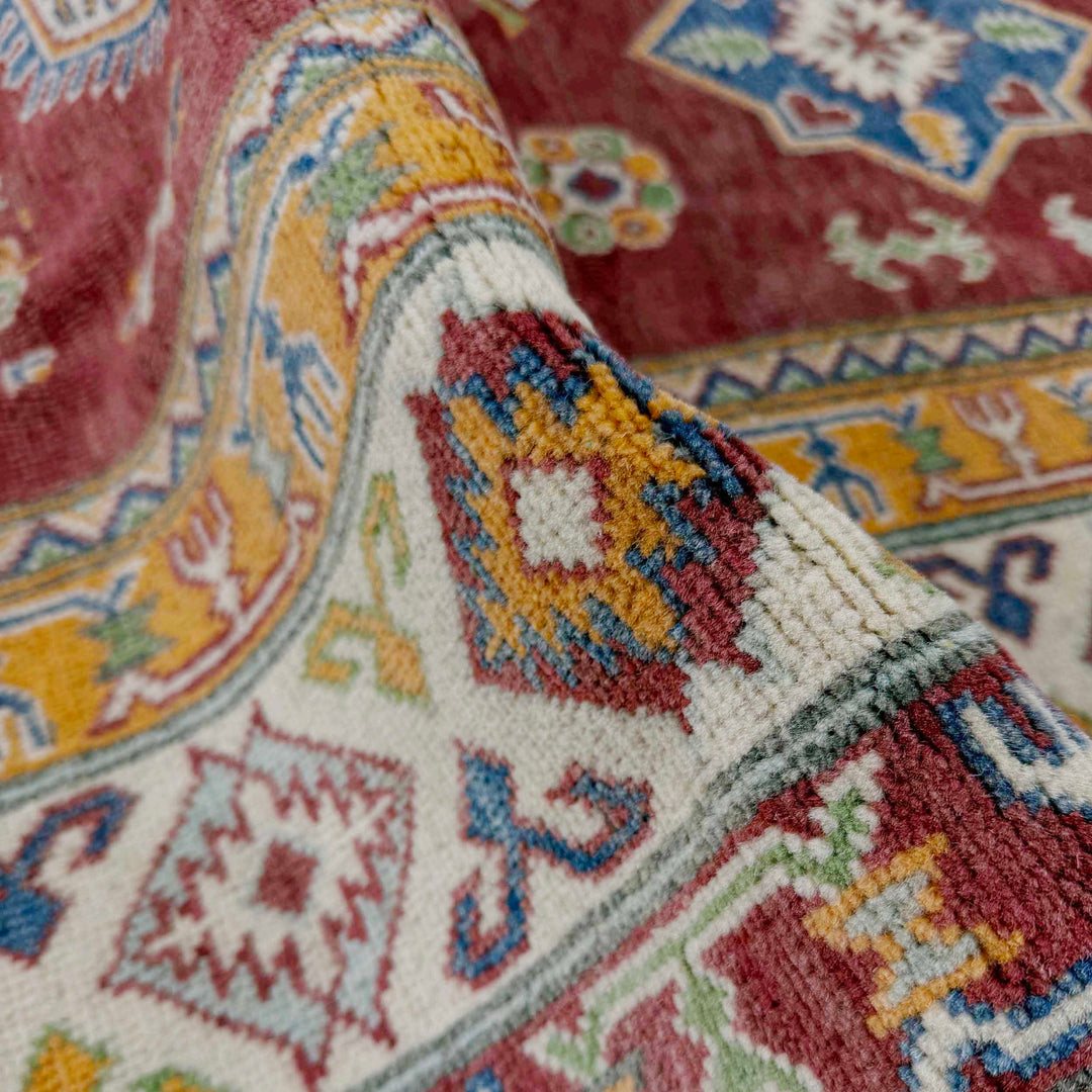 Red Afghan Kazak Rug 6' 7" x 9' 11" Hand-Knotted texture