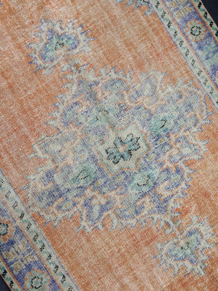 Rust Turkish Runner Rug 5' 7" x 9' 5" Hand-Knotted close-up