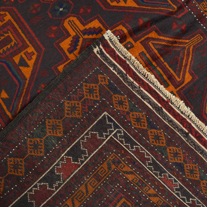 Afghan Baluchi Rug 4' 2" x 6' 3" Hand-Knotted close-up