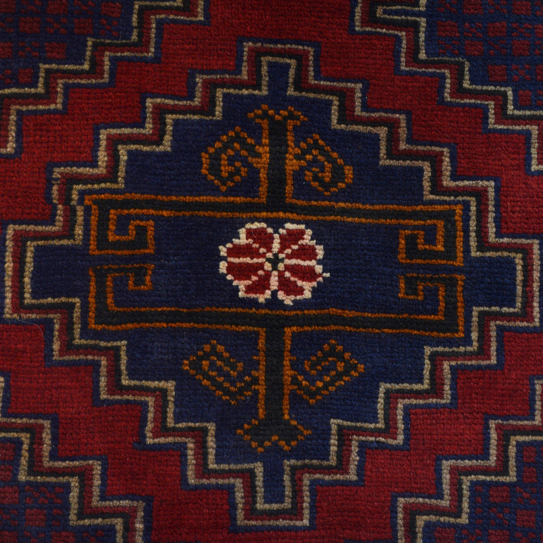 Red Afghan Baluchi Rug 2' 9" x 4' 10" Hand-Knotted close-up