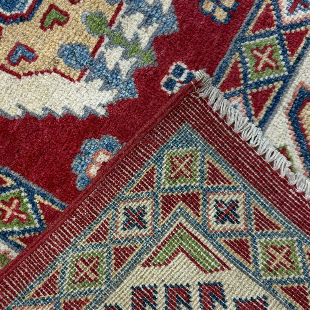 Red Afghan Kazak Rug 6' 6" x 10' 1" Hand-Knotted border