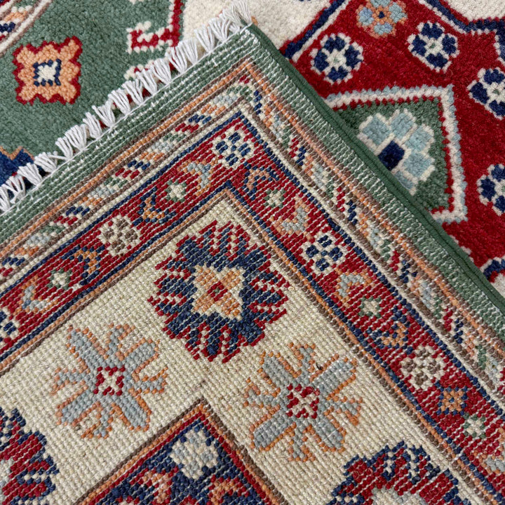 Green Afghan Kazak Rug 3' 2" x 4' 9" Hand-Knotted border