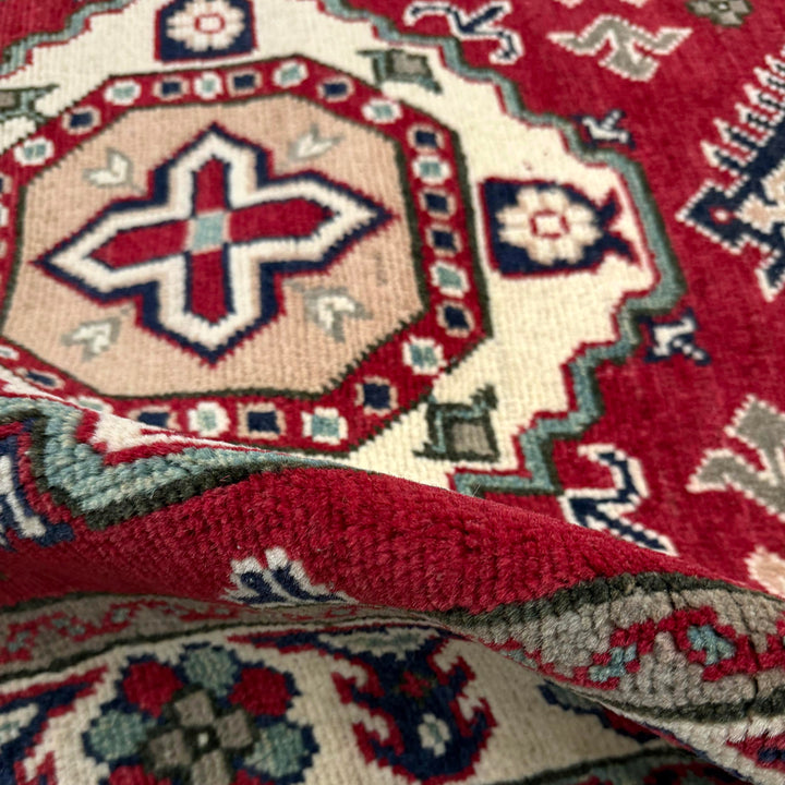 Red Afghan Kazak Rug 2' 7" x 4' 1" Hand-Knotted texture
