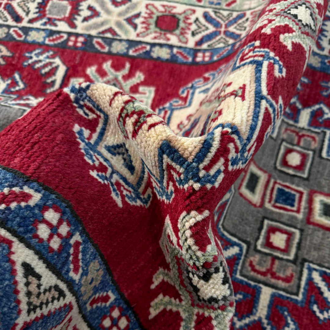 Red Afghan Kazak Rug 2' 9" x 4' 2" Hand-Knotted texture