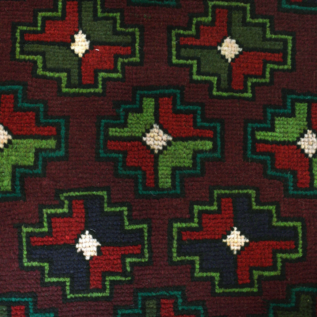 Afghan Baluchi Rug 4' 0" x 6' 4" Hand-Knotted close-up