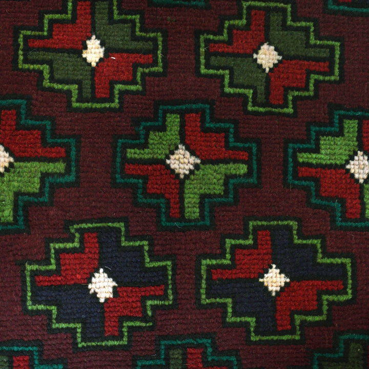 Afghan Baluchi Rug 4' 0" x 6' 4" Hand-Knotted close-up