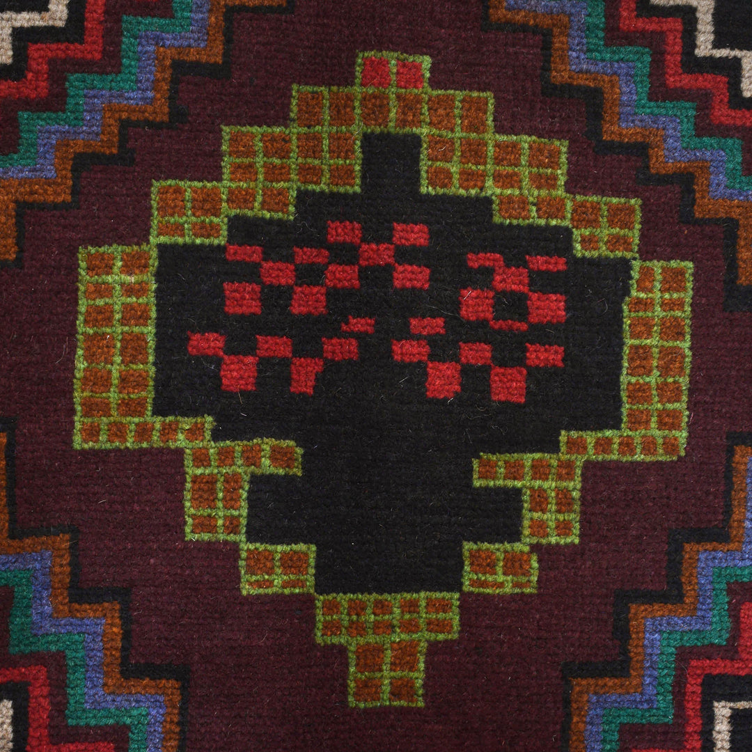 Black Afghan Baluchi Rug 4' 1" x 5' 11" Hand-Knotted close-up