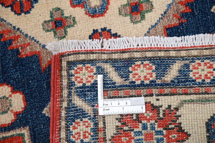 Kazak 4’ 11” x 6’ 6″ - No. AV69664 - ALRUG Rug Store