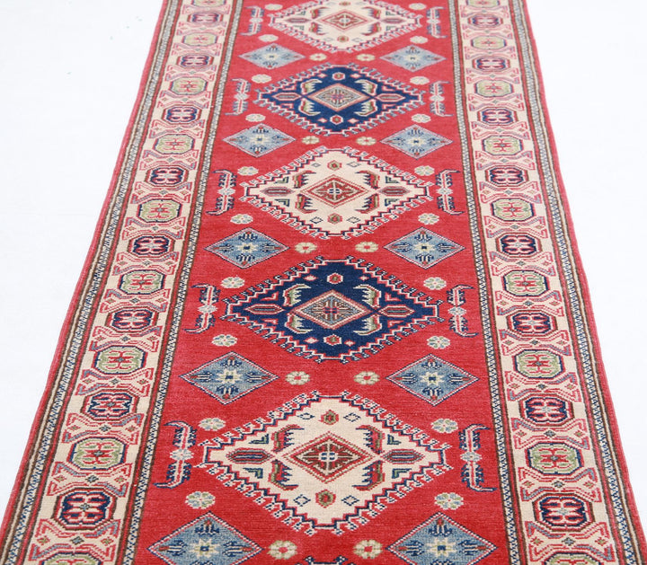 Kazak 2’ 9″ x 9’ 11” - No. AV89033 - ALRUG Rug Store