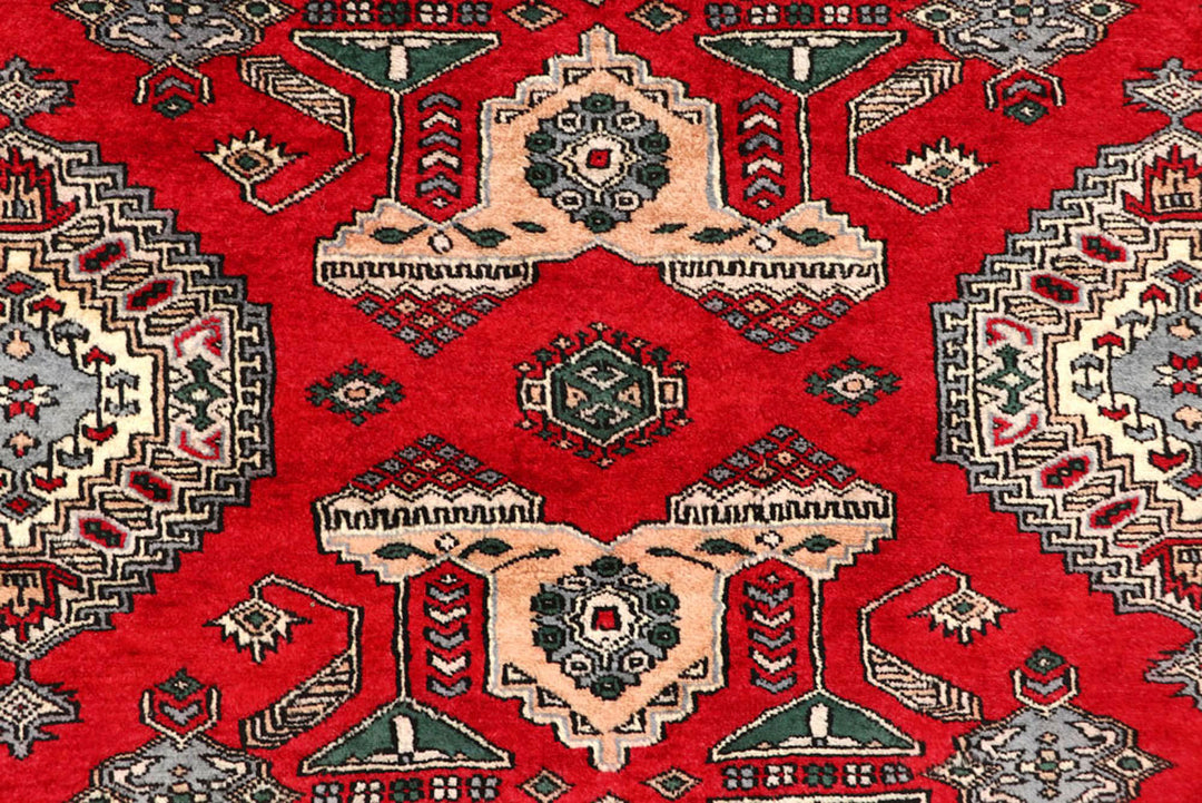 Red Caucasian Oriental Rug 6' 9" x 7' 2" Hand-Knotted close-up